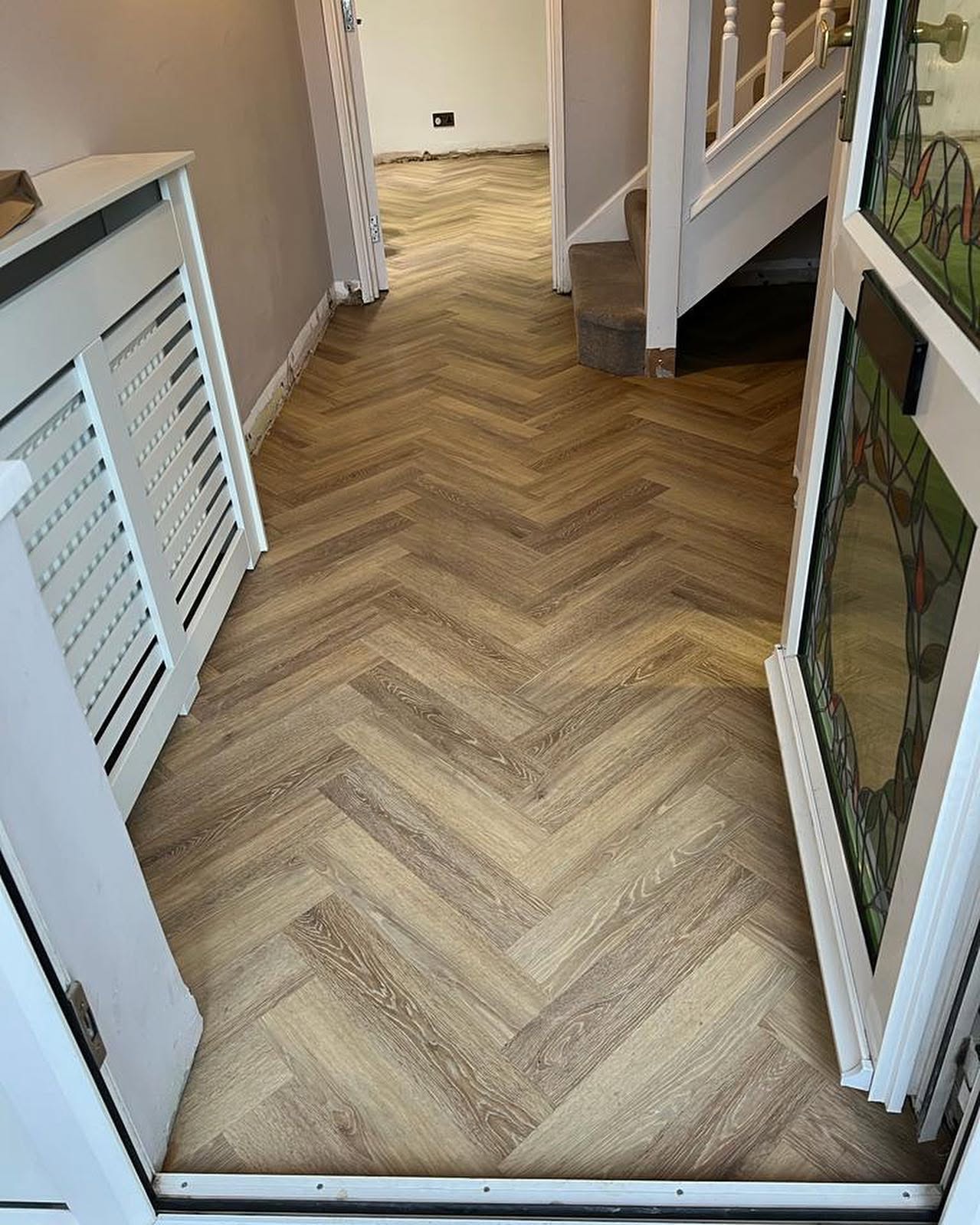 Karndean limed washed oak straight plank extended into this lounge area from a pre existing hallway. 