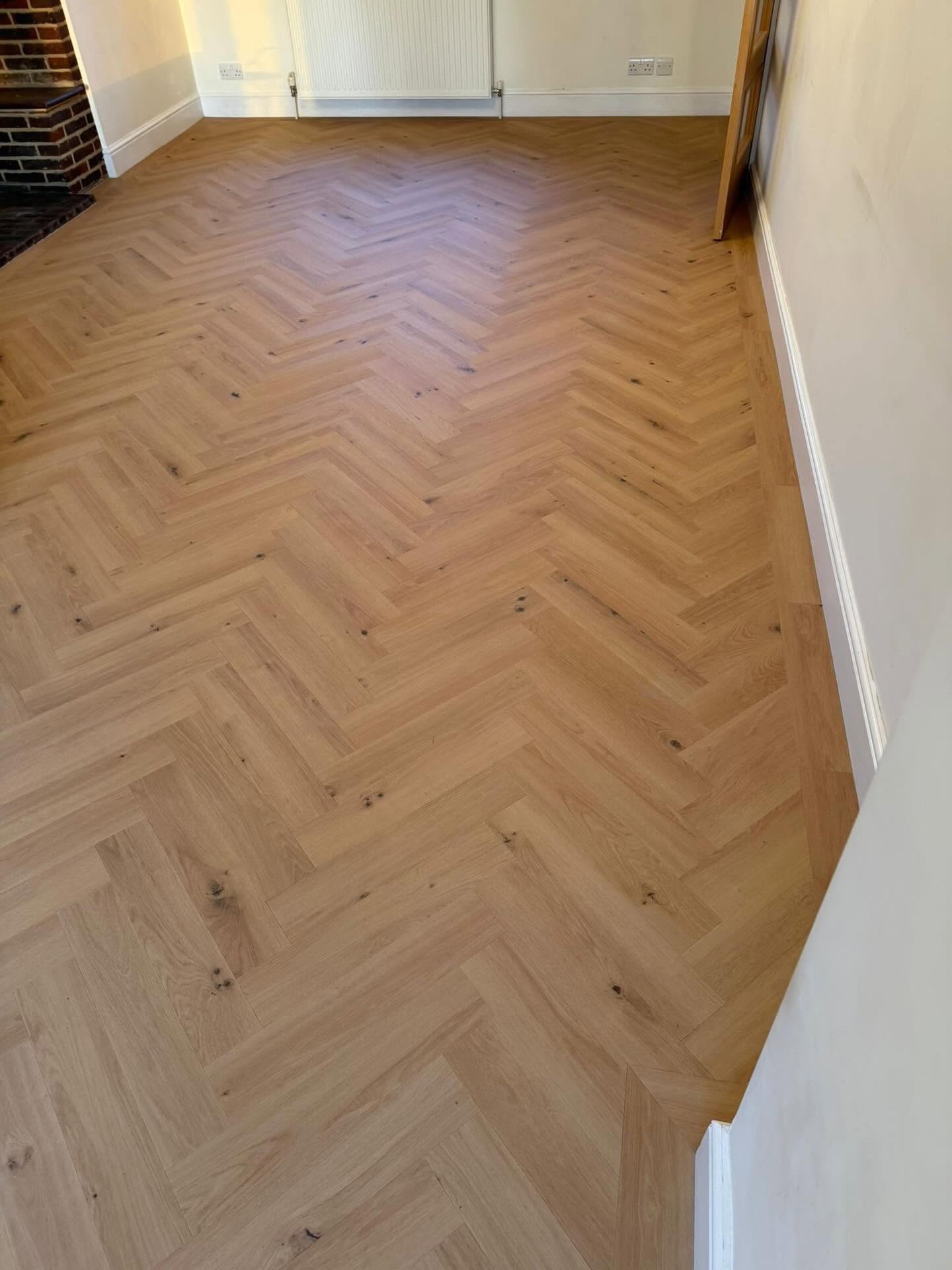 Our rhinofloor evolution herringbone honey oak LVT installed beautifully  in this lounge area